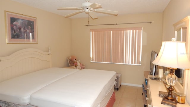 4744 Azalea Dr Unit 203B, New Port Richey, FL 34652 - bedroom featuring light tile patterned floors and a ceiling fan