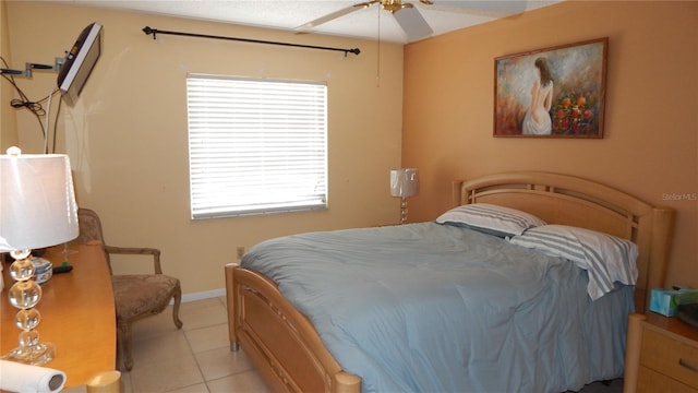 4744 Azalea Dr Unit 203B, New Port Richey, FL 34652 - bedroom with light tile patterned floors, ceiling fan, and baseboards