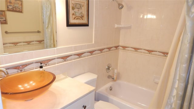 4744 Azalea Dr Unit 203B, New Port Richey, FL 34652 - bathroom featuring vanity, toilet, shower / bath combo with shower curtain, and decorative backsplash