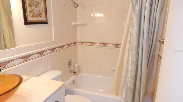 4744 Azalea Dr Unit 203B, New Port Richey, FL 34652 - bathroom featuring tile walls, toilet, shower / bath combo with shower curtain, and vanity