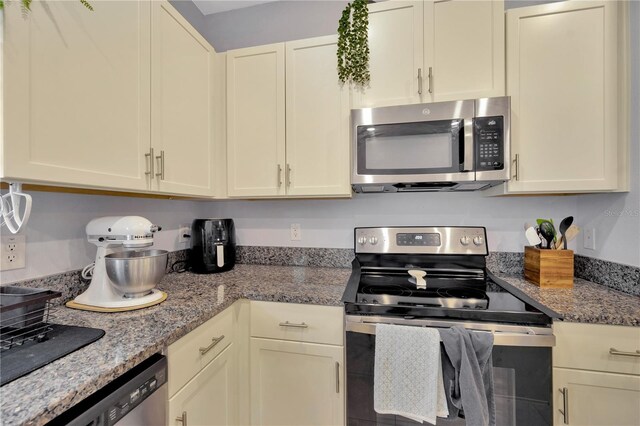 842 Tennyson Mill Cir, Tampa, FL 33619 - kitchen featuring appliances with stainless steel finishes and stone countertops