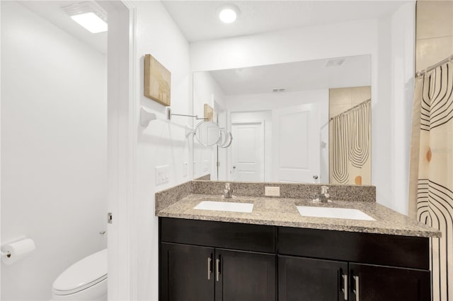 842 Tennyson Mill Cir, Tampa, FL 33619 - bathroom with toilet and double vanity