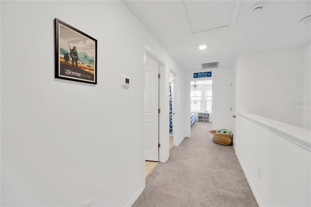 842 Tennyson Mill Cir, Tampa, FL 33619 - hall with light carpet, baseboards, and recessed lighting