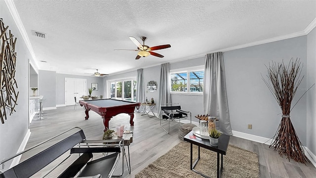 playroom featuring billiards table, wood finished floors, crown molding, ceiling fan, and baseboards