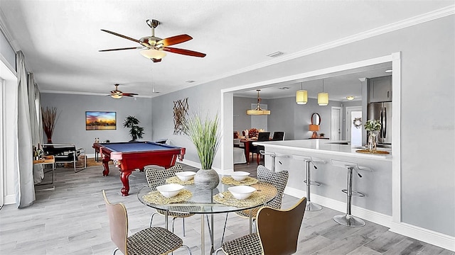 playroom featuring light wood-style floors, a ceiling fan, baseboards, billiards table, and crown molding