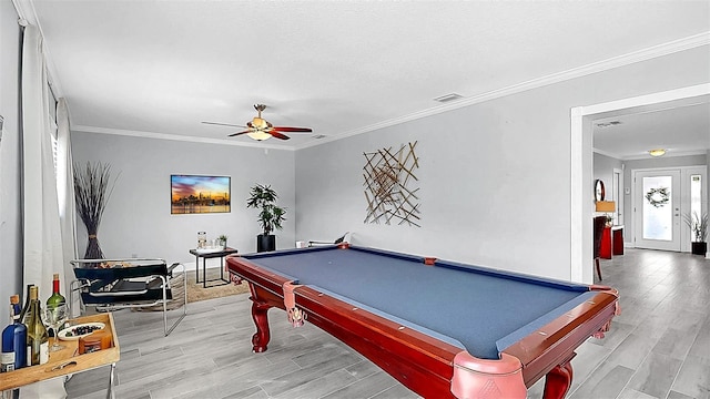 recreation room featuring wood finished floors, ceiling fan, billiards table, ornamental molding, and baseboards
