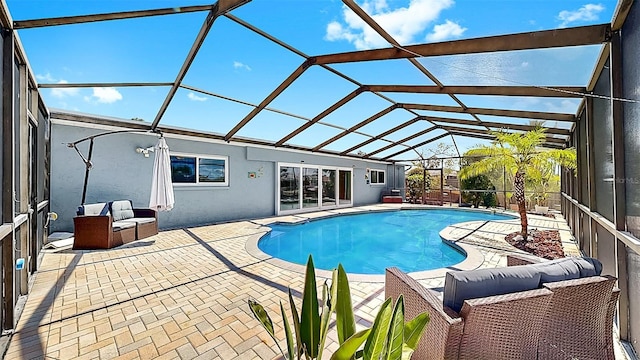 outdoor pool featuring a patio, an outdoor living space, and glass enclosure