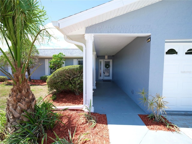 doorway to property with stucco siding