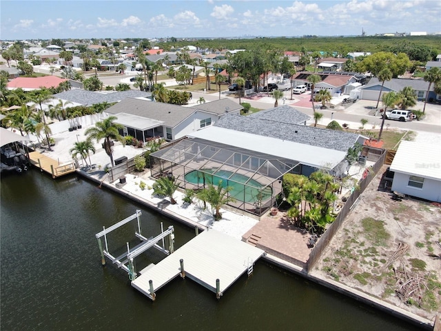 aerial perspective of suburban area with a nearby body of water