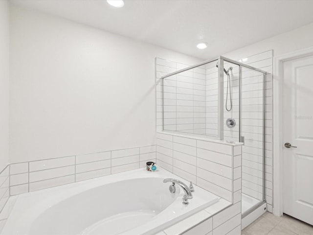 17729 Nectar Flume Dr, Land O Lakes, FL 34638 - bathroom with a stall shower, a garden tub, recessed lighting, and tile patterned flooring
