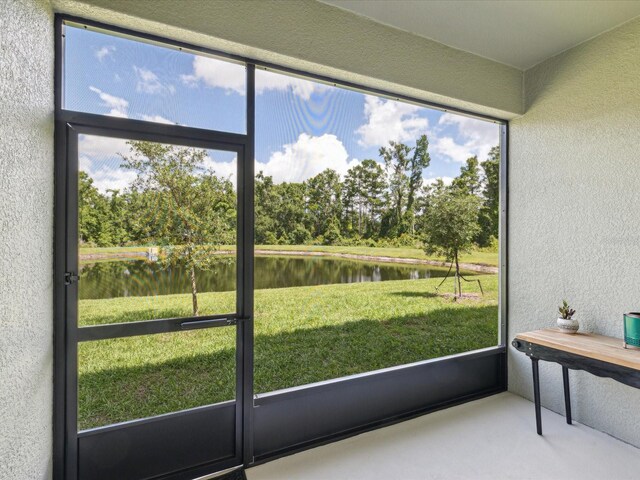 17729 Nectar Flume Dr, Land O Lakes, FL 34638 - sunroom featuring a water view, view of scattered trees, and plenty of natural light