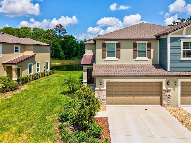 17729 Nectar Flume Dr, Land O Lakes, FL 34638 - multi unit property with stone siding, stucco siding, an attached garage, concrete driveway, and a front lawn