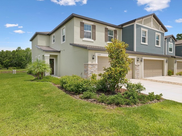 17729 Nectar Flume Dr, Land O Lakes, FL 34638 - view of front of home featuring an attached garage, stucco siding, stone siding, concrete driveway, and a front lawn