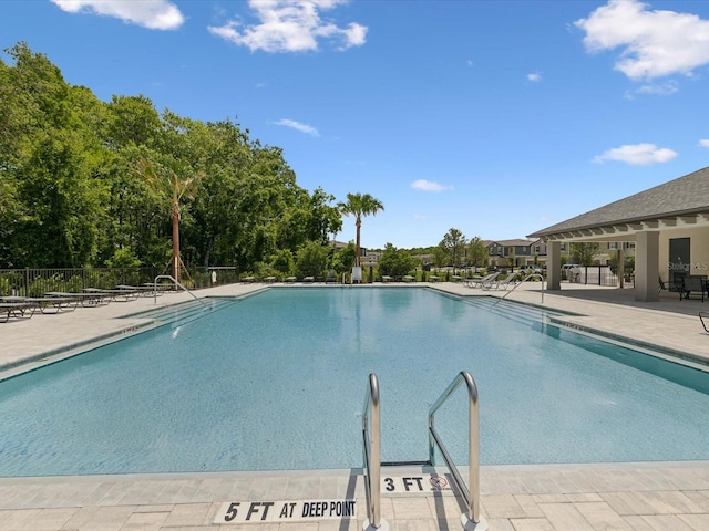 17729 Nectar Flume Dr, Land O Lakes, FL 34638 - community pool with a patio and fence
