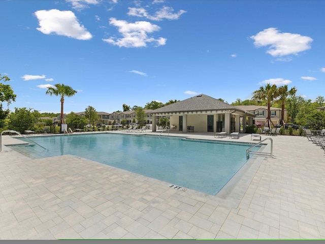 17729 Nectar Flume Dr, Land O Lakes, FL 34638 - community pool with a patio area