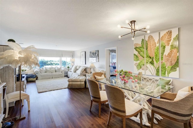 100 Bluff View Dr Unit 405A, Belleair Bluffs, FL 33770 - dining room featuring a chandelier and wood finished floors