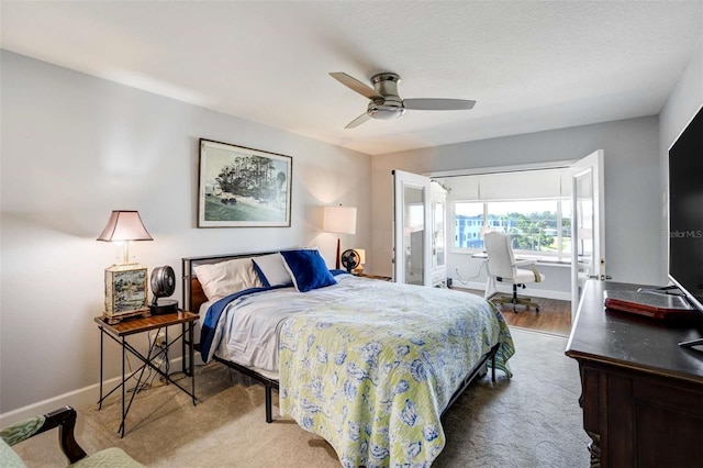 100 Bluff View Dr Unit 405A, Belleair Bluffs, FL 33770 - bedroom featuring an office area, baseboards, and ceiling fan