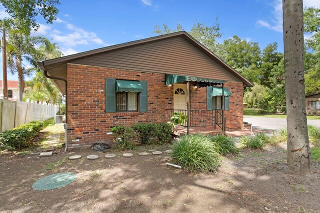 3005 W Sligh Ave, Tampa, FL 33614 - bungalow-style home featuring brick siding and fence