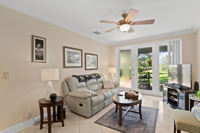 3005 W Sligh Ave, Tampa, FL 33614 - living area with ornamental molding, light tile patterned floors, a ceiling fan, and baseboards