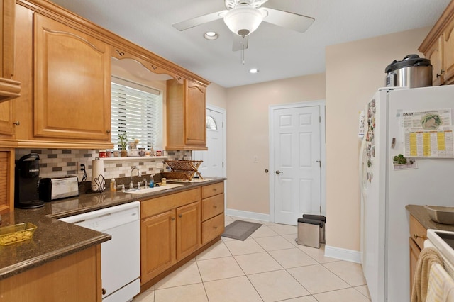 3005 W Sligh Ave, Tampa, FL 33614 - kitchen featuring white appliances, a sink, backsplash, light tile patterned floors, and ceiling fan