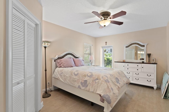 3005 W Sligh Ave, Tampa, FL 33614 - bedroom featuring light wood-style floors, baseboards, ceiling fan, and a closet