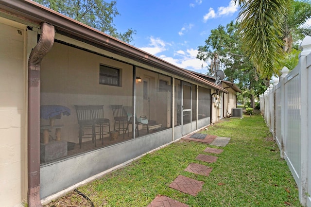 3005 W Sligh Ave, Tampa, FL 33614 - view of yard featuring a sunroom and central air condition unit