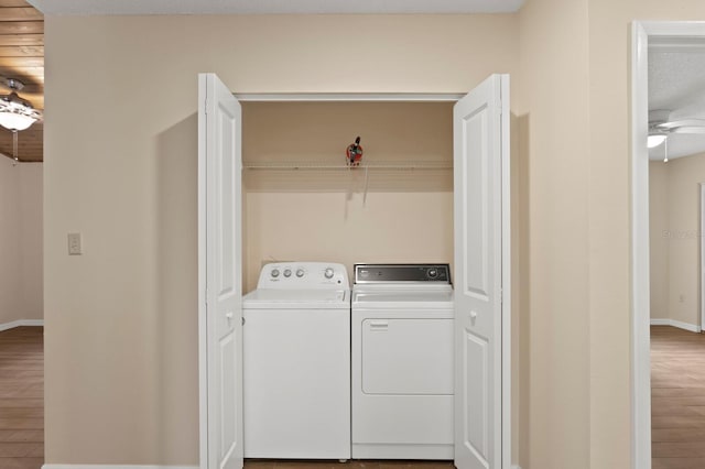 3005 W Sligh Ave, Tampa, FL 33614 - laundry area with independent washer and dryer, wood finished floors, and baseboards