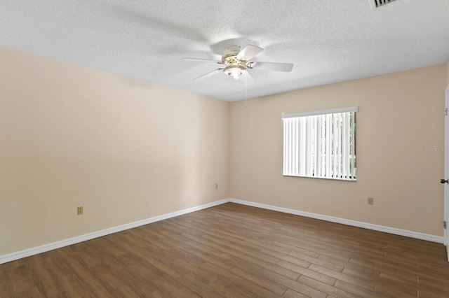 3005 W Sligh Ave, Tampa, FL 33614 - empty room featuring a ceiling fan, wood finished floors, a textured ceiling, and baseboards