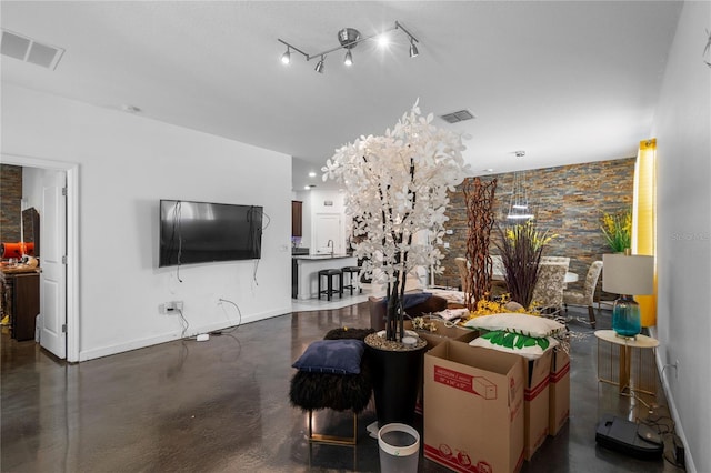9931 Victory Gallop Loop, Ruskin, FL 33573 - living area with concrete flooring and baseboards