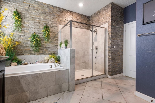 9931 Victory Gallop Loop, Ruskin, FL 33573 - full bathroom with a shower stall, a bath, tile patterned flooring, and a textured ceiling