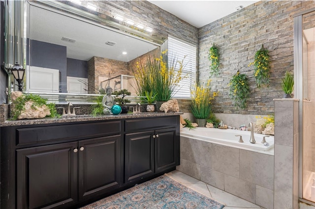 9931 Victory Gallop Loop, Ruskin, FL 33573 - full bathroom with a bath, double vanity, and tile patterned flooring