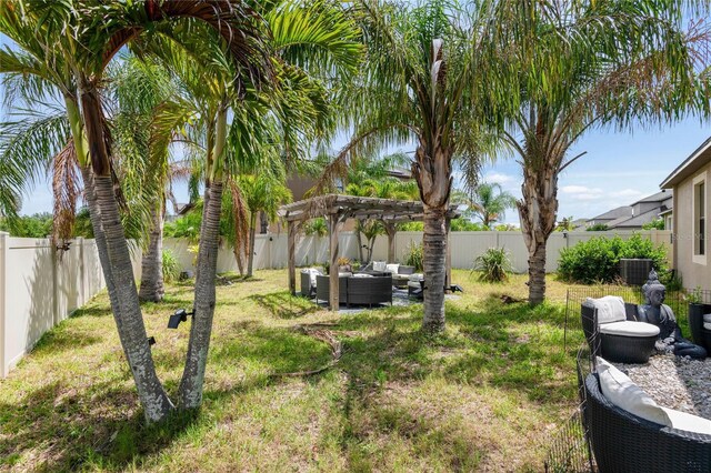 9931 Victory Gallop Loop, Ruskin, FL 33573 - view of yard featuring an outdoor hangout area and a pergola