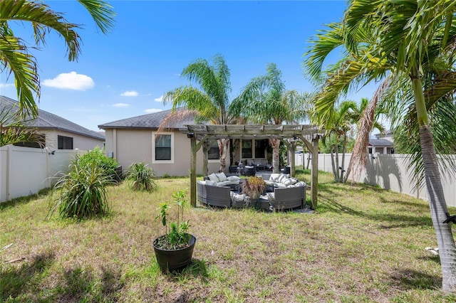 9931 Victory Gallop Loop, Ruskin, FL 33573 - rear view of house featuring an outdoor living space, stucco siding, and a pergola