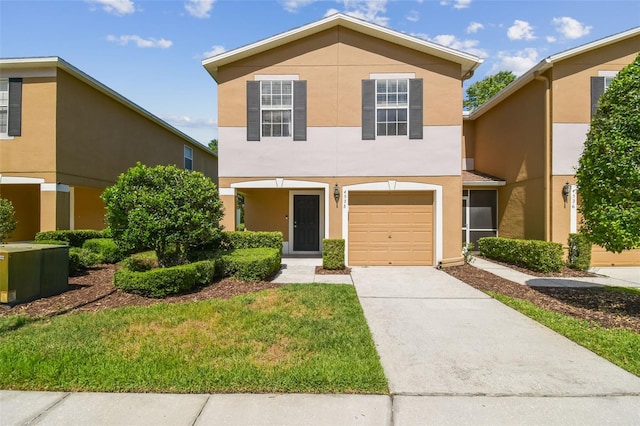 4528 Winding River Way, Land O Lakes, FL 34639 - view of front facade with stucco siding, concrete driveway, a garage, and a front lawn