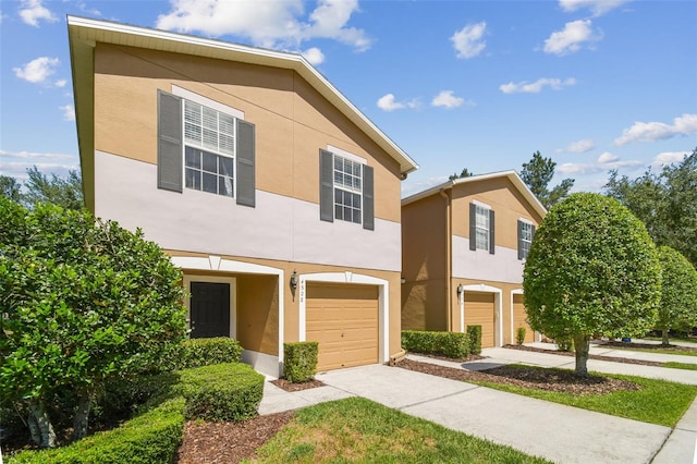 4528 Winding River Way, Land O Lakes, FL 34639 - multi unit property featuring stucco siding, an attached garage, and concrete driveway