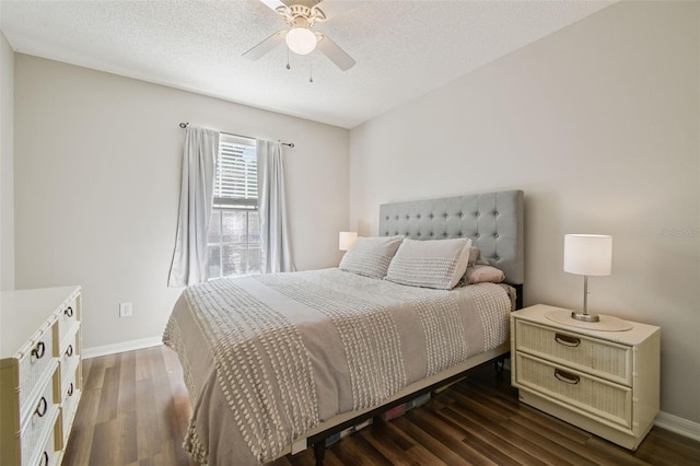 4528 Winding River Way, Land O Lakes, FL 34639 - bedroom featuring dark wood-style flooring, baseboards, ceiling fan, and a textured ceiling