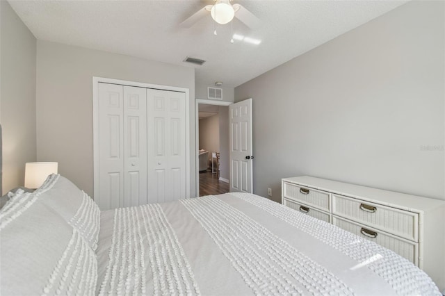 4528 Winding River Way, Land O Lakes, FL 34639 - bedroom featuring a closet, wood finished floors, and a ceiling fan