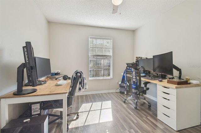 4528 Winding River Way, Land O Lakes, FL 34639 - office area featuring wood finished floors, a textured ceiling, baseboards, and a ceiling fan