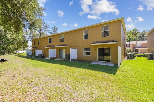 4528 Winding River Way, Land O Lakes, FL 34639 - back of property featuring stucco siding and central AC unit