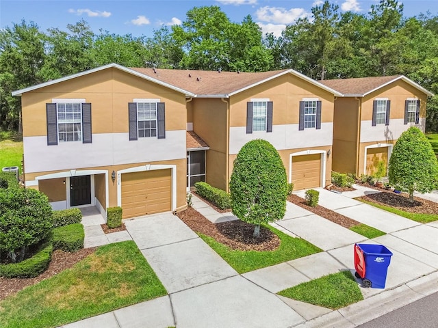 4528 Winding River Way, Land O Lakes, FL 34639 - multi unit property with an attached garage, stucco siding, and driveway