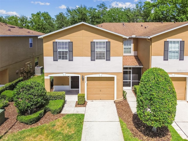 4528 Winding River Way, Land O Lakes, FL 34639 - multi unit property with stucco siding, a garage, concrete driveway, and central air condition unit