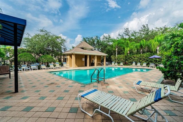 4528 Winding River Way, Land O Lakes, FL 34639 - community pool with a patio area