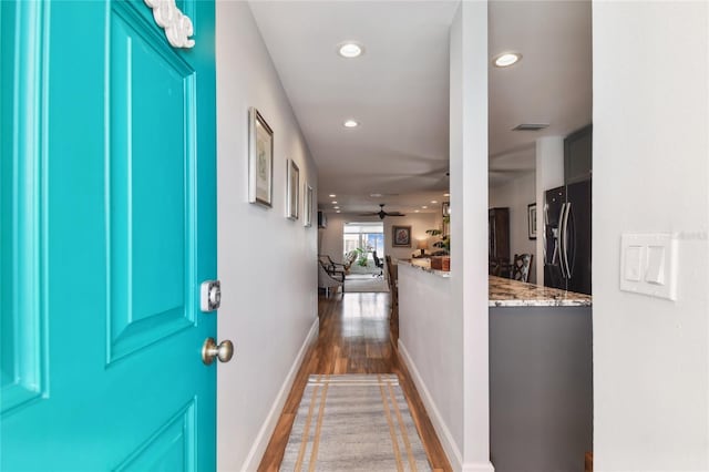 2960 59th St S Unit 614, Gulfport, FL 33707 - corridor featuring wood finished floors, recessed lighting, and baseboards