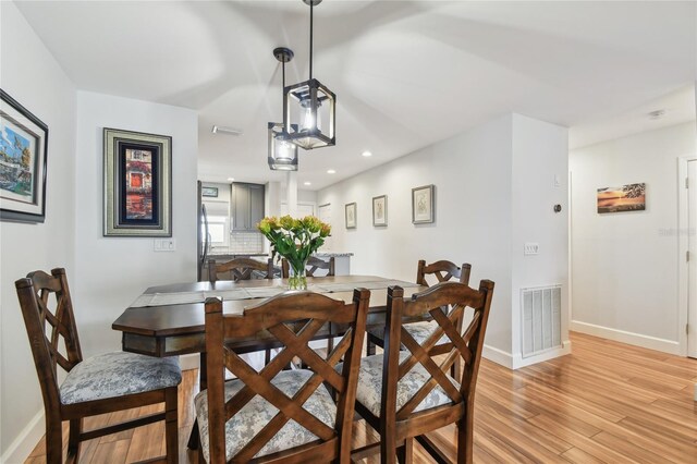 2960 59th St S Unit 614, Gulfport, FL 33707 - dining room with baseboards, light wood-style floors, and recessed lighting