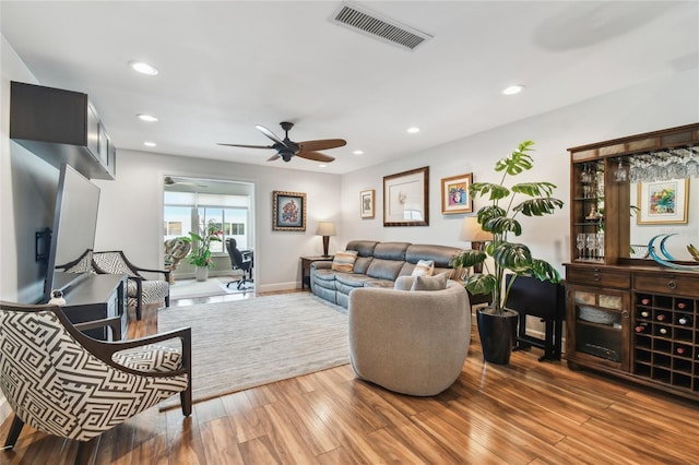 2960 59th St S Unit 614, Gulfport, FL 33707 - living area with wood finished floors, ceiling fan, recessed lighting, and baseboards