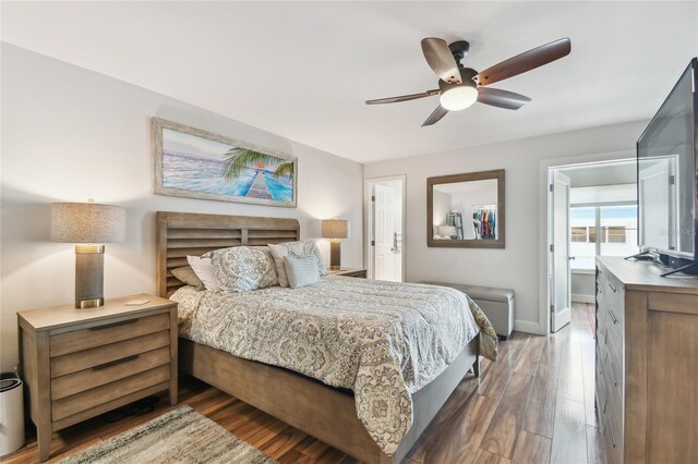 2960 59th St S Unit 614, Gulfport, FL 33707 - bedroom with wood finished floors, baseboards, and ceiling fan