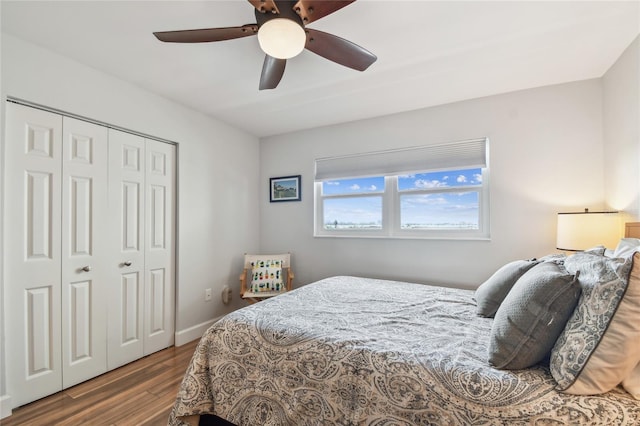 2960 59th St S Unit 614, Gulfport, FL 33707 - bedroom featuring wood finished floors, a closet, ceiling fan, and baseboards