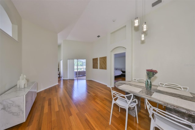 14502 Pond Cypress Way, Tampa, FL 33626 - dining space featuring wood finished floors, baseboards, and arched walkways
