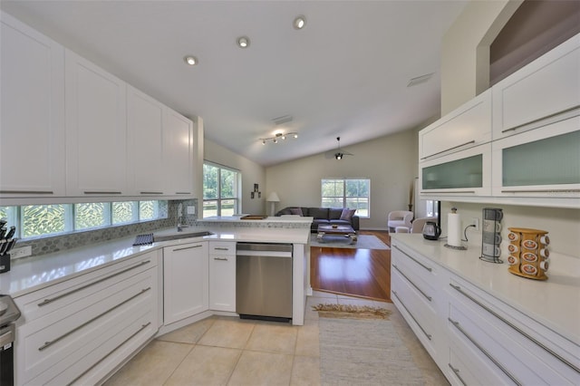 14502 Pond Cypress Way, Tampa, FL 33626 - kitchen featuring dishwasher, open floor plan, vaulted ceiling, white cabinetry, and light countertops
