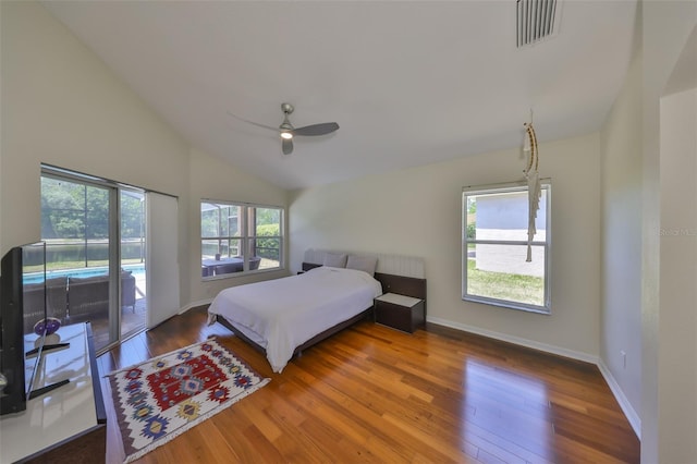 14502 Pond Cypress Way, Tampa, FL 33626 - bedroom featuring vaulted ceiling, access to outside, wood finished floors, a ceiling fan, and baseboards
